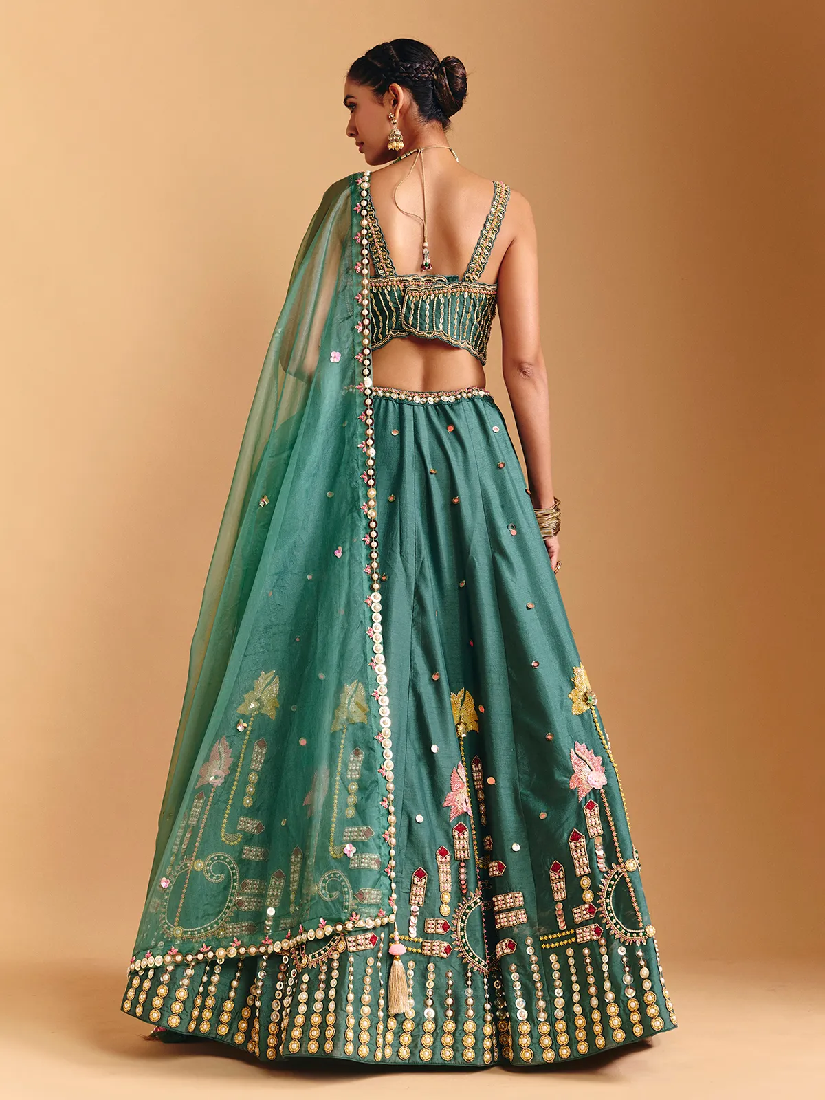 Green raw silk lehenga choli with pearl embellishments