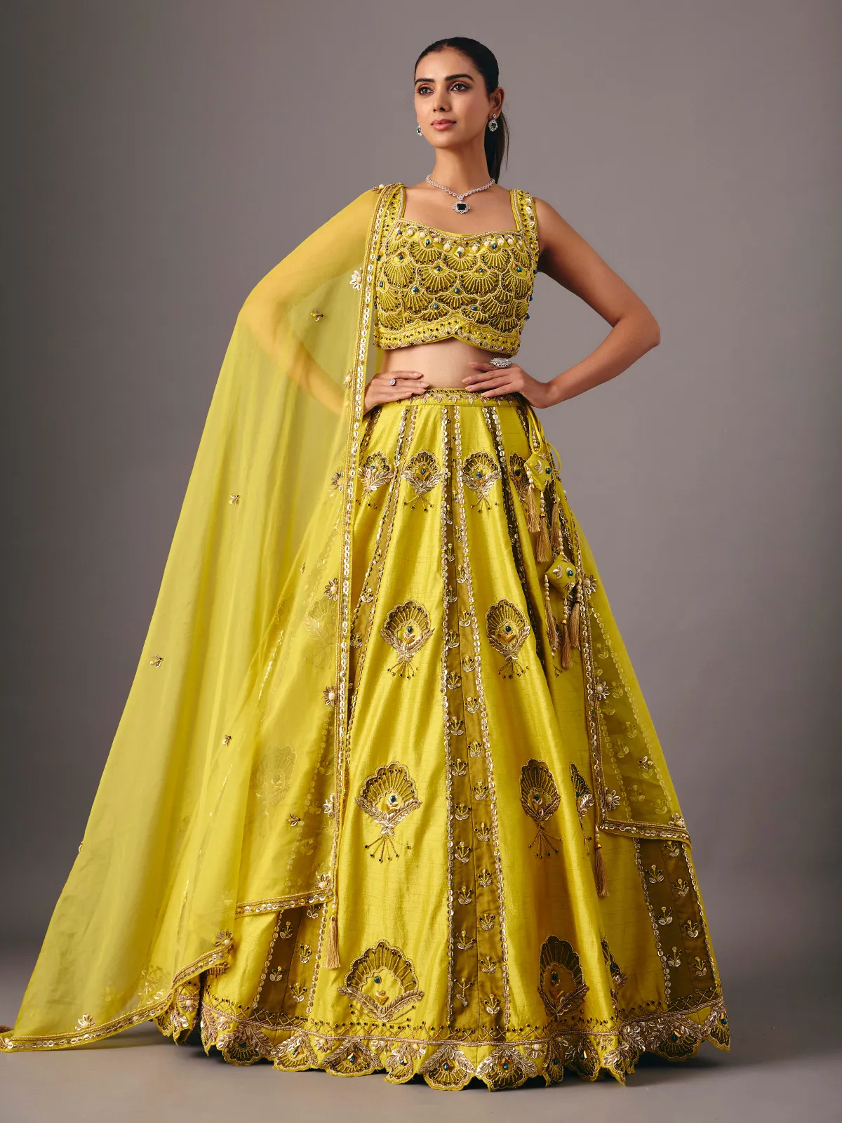 Lemon yellow raw silk lehenga choli with pearl embellishments