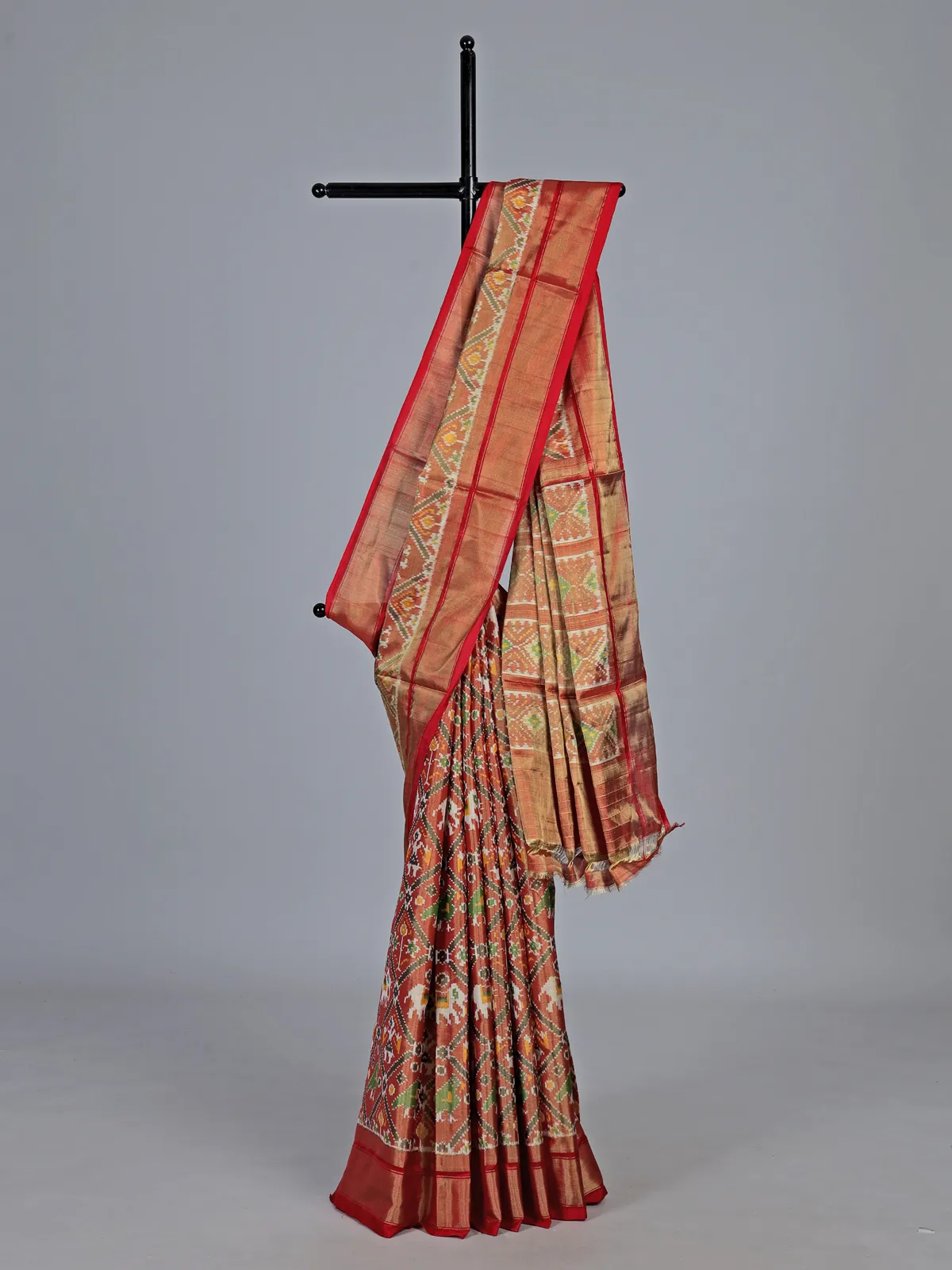 Light brown hyderabadi patola silk saree with heritage motifs