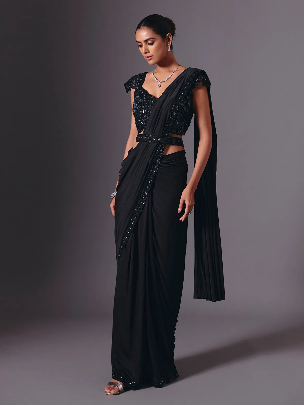 Luxe black lycra saree with diamond and cutdana accents