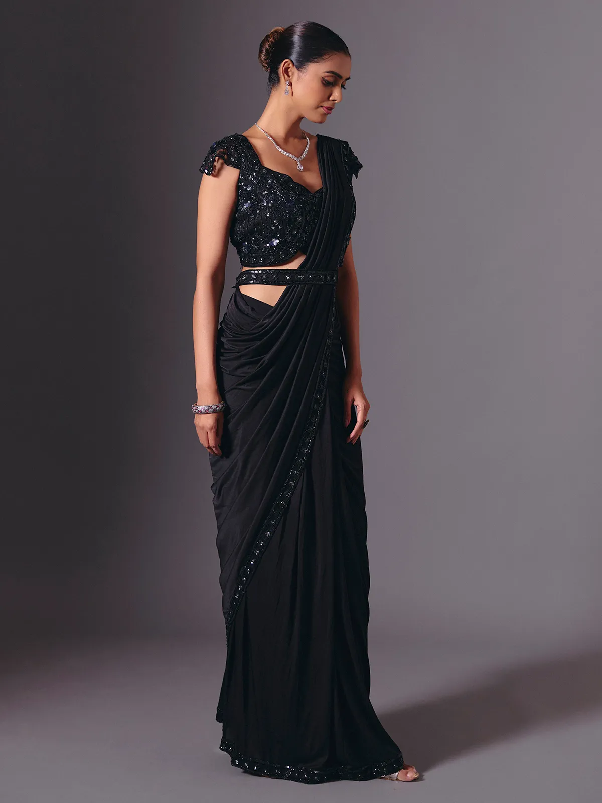 Luxe black lycra saree with diamond and cutdana accents