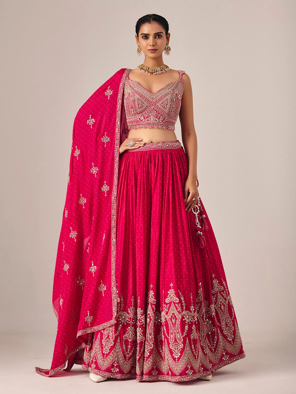 Magenta silk lehenga choli with mirror and embroidered artistry