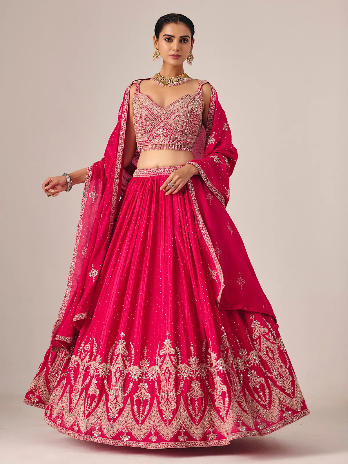 Magenta silk lehenga choli with mirror and embroidered artistry