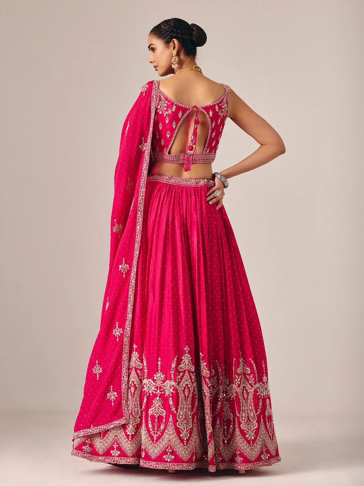 Magenta silk lehenga choli with mirror and embroidered artistry