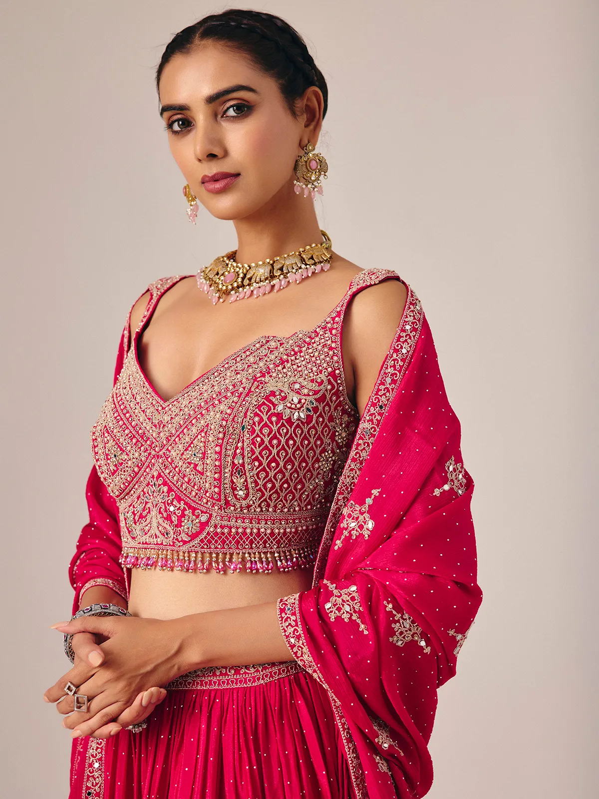 Magenta silk lehenga choli with mirror and embroidered artistry