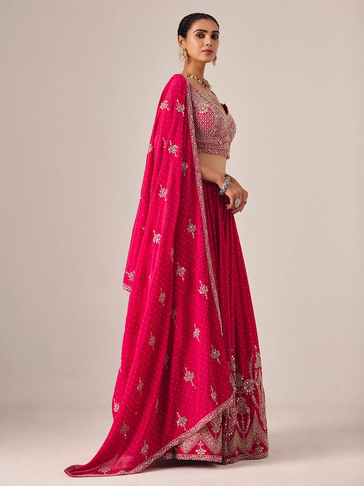 Magenta silk lehenga choli with mirror and embroidered artistry