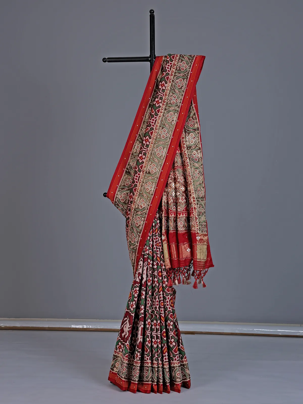 Maroon and green art patola silk saree with motifs