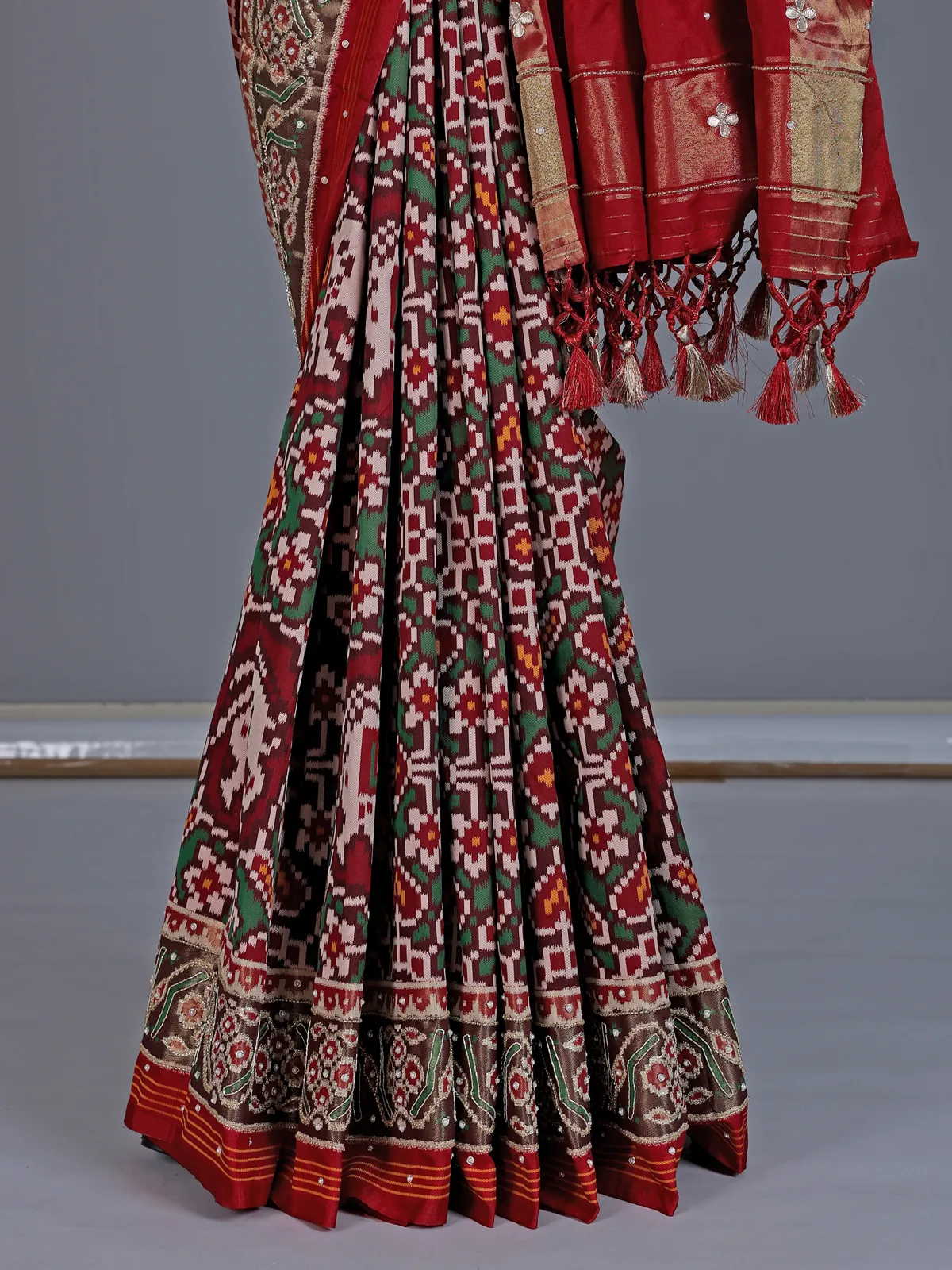 Maroon and green art patola silk saree with motifs