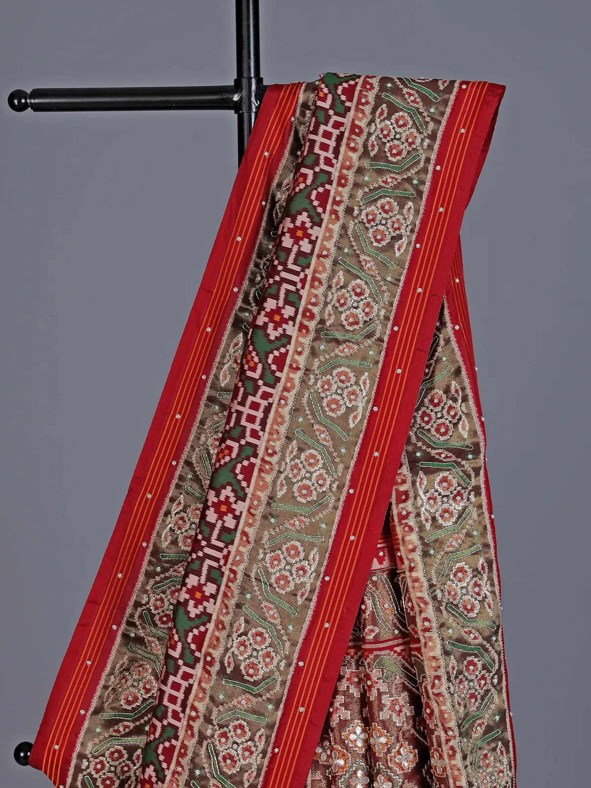 Maroon and green art patola silk saree with motifs