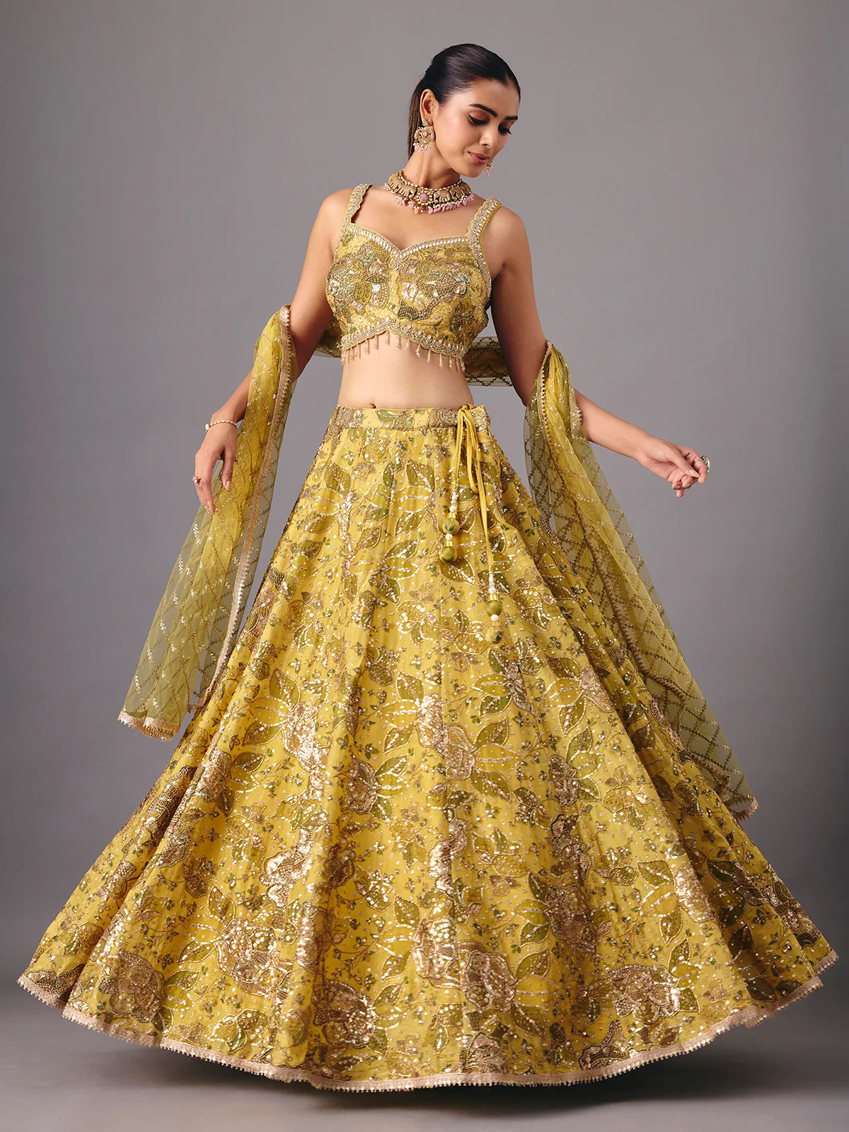 Mehendi yellow georgette silk lehenga choli with embellishments