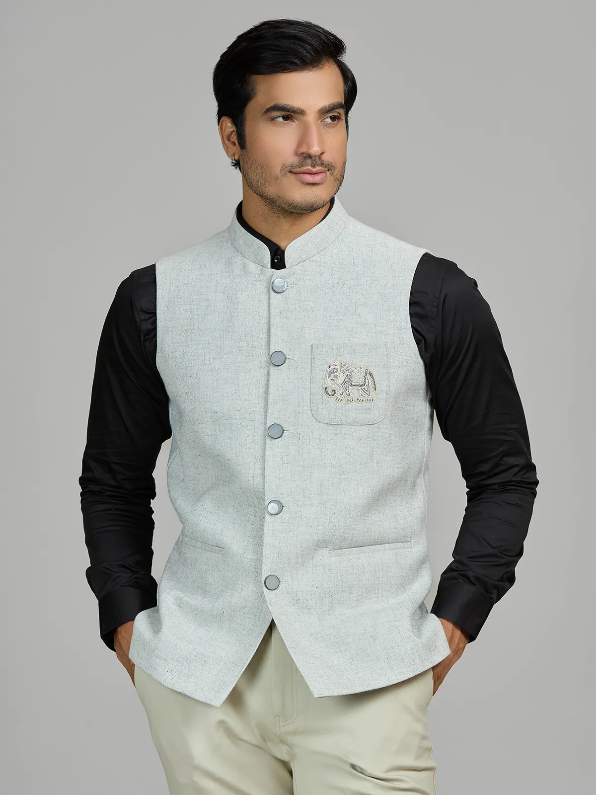 Mint blue linen wedding waistcoat with embellished pocket