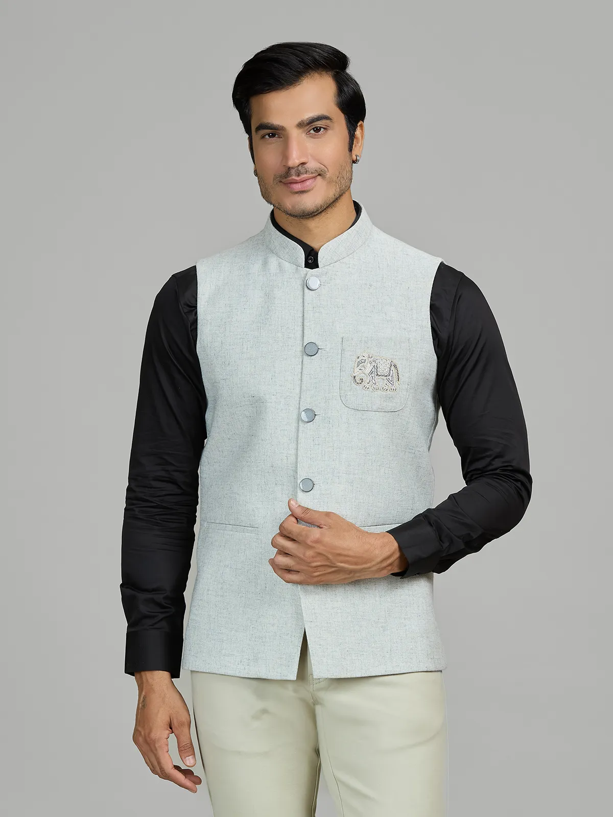 Mint blue linen wedding waistcoat with embellished pocket