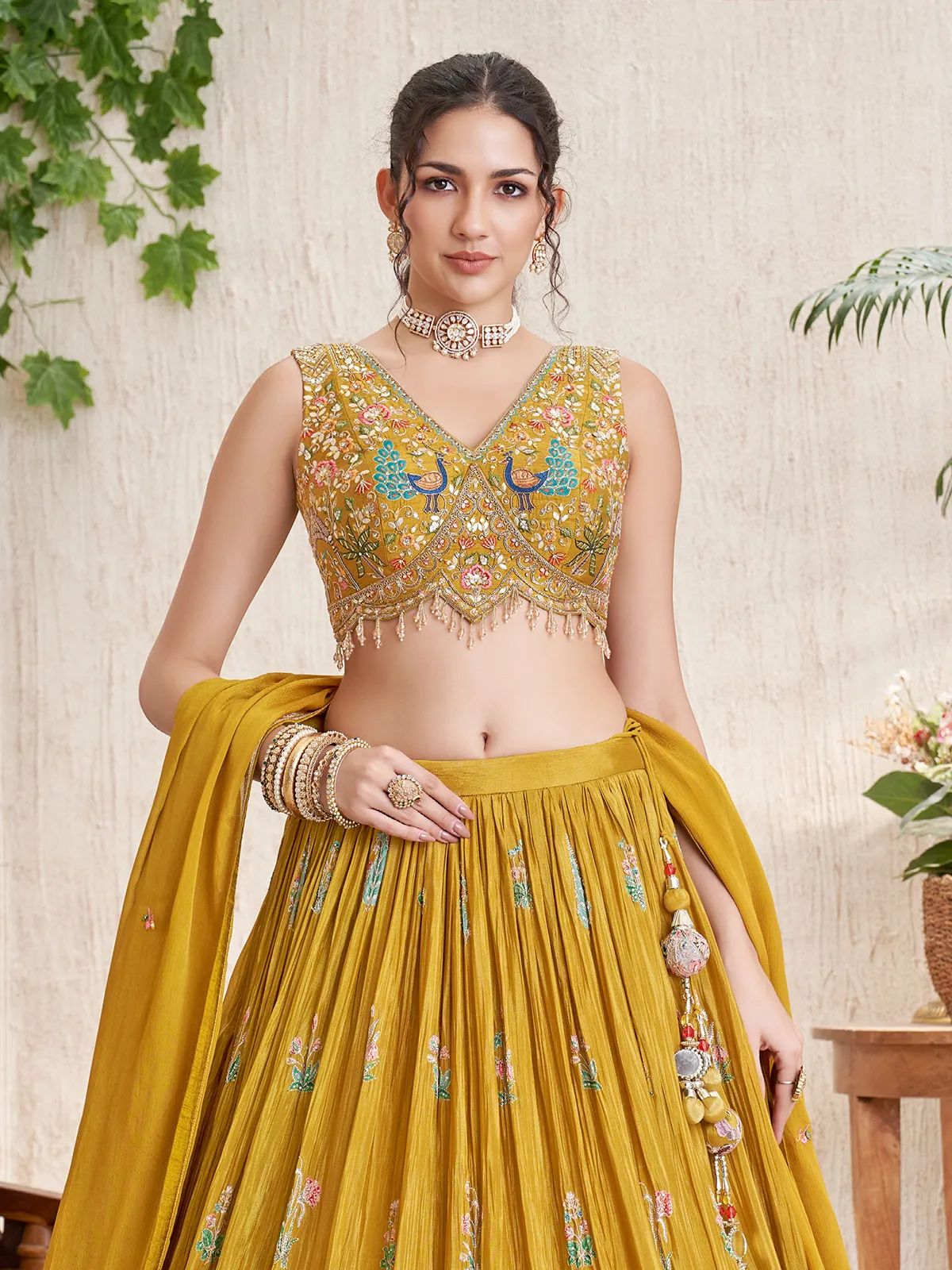 Mustard silk lehenga choli with peacock and deer motifs