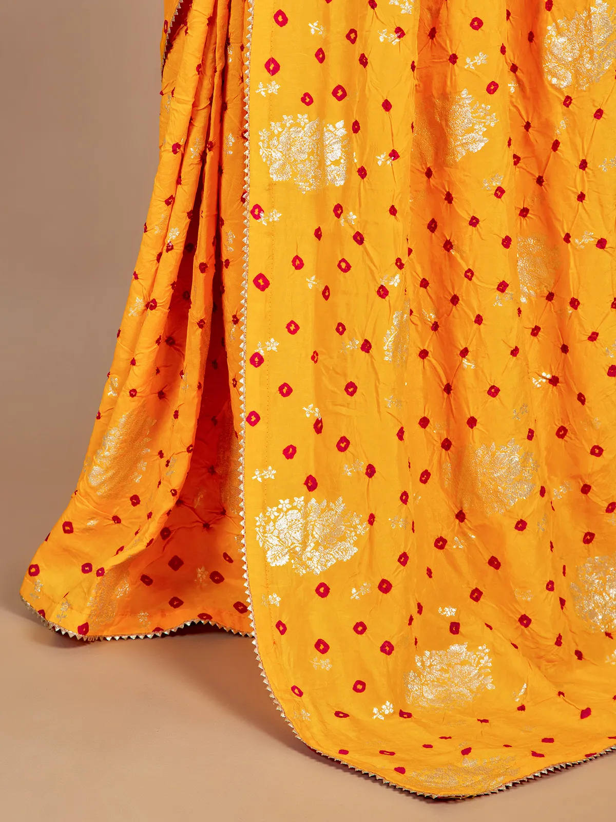 Mustard yellow bandhej wedding look saree