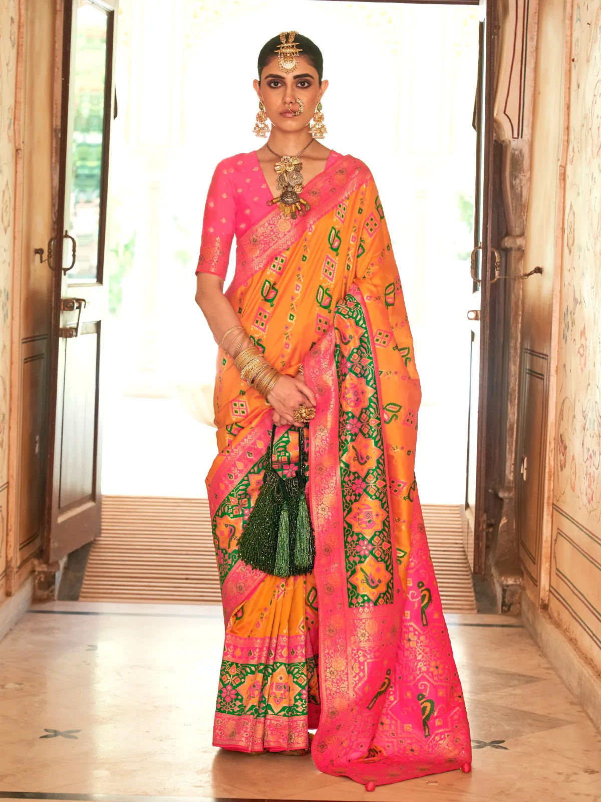 Mustard yellow rich patola silk saree