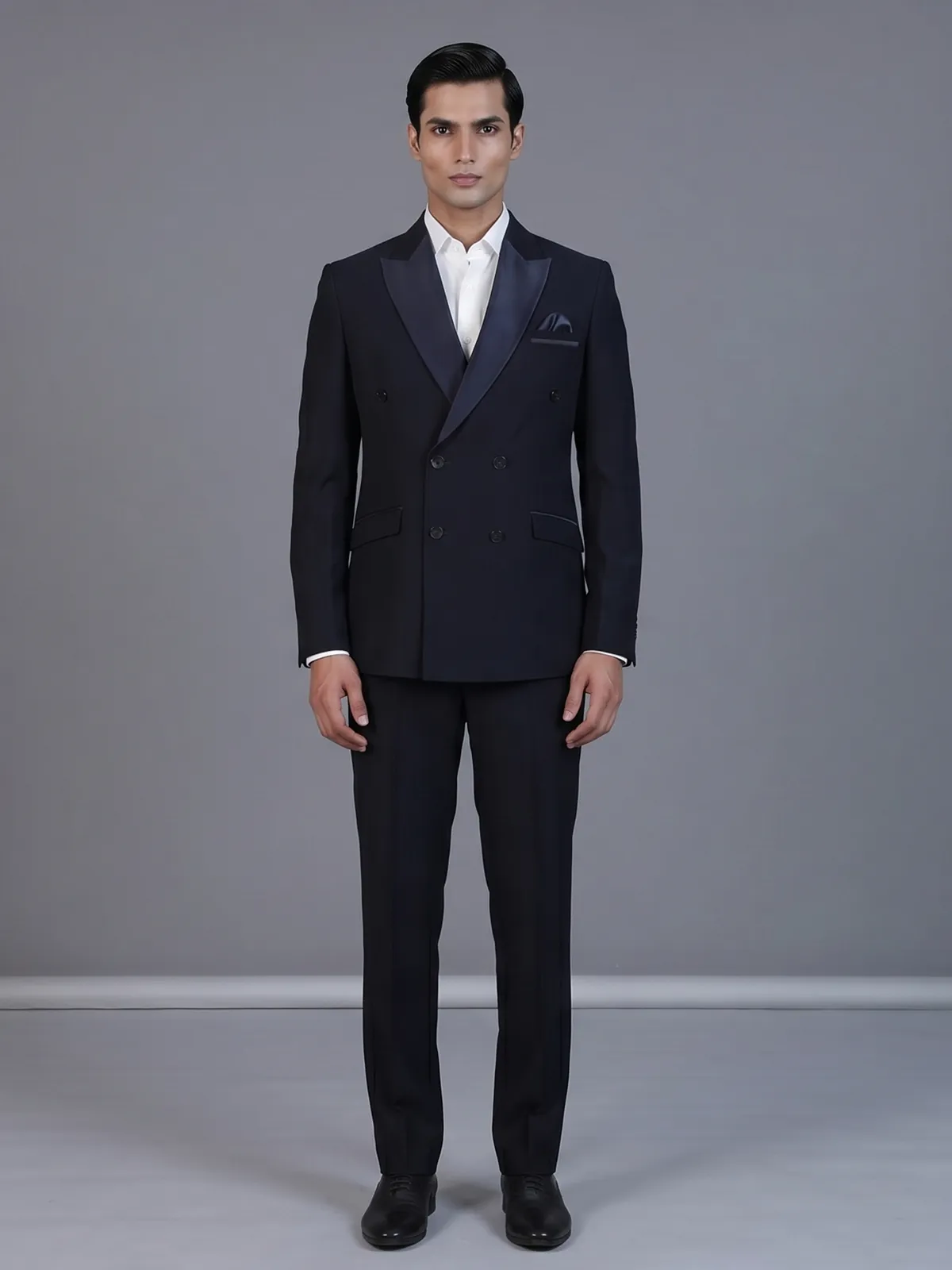 Navy blue designer double breasted suit with satin peak lapel finish