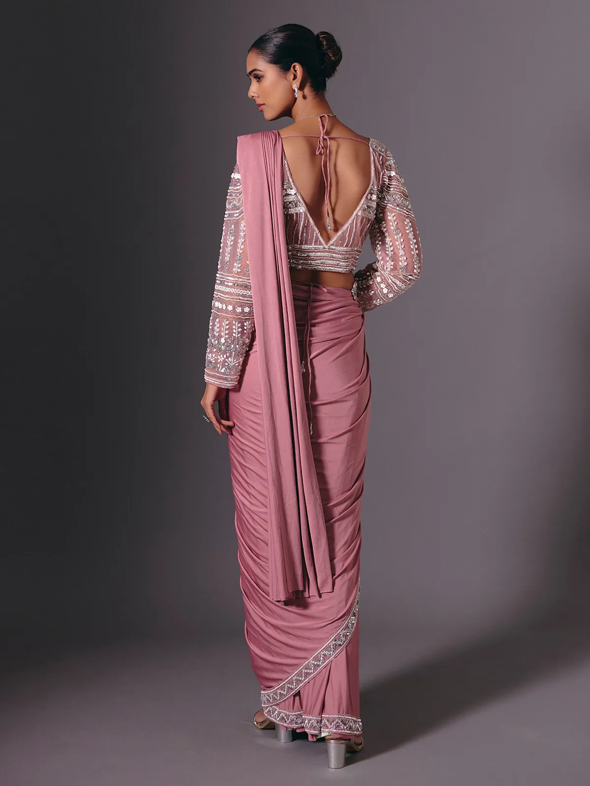 Onion pink lycra saree with heavy festive embellishments