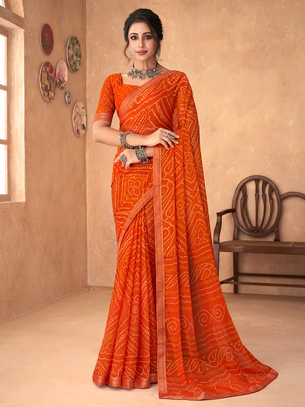 Orange bandhej printed chiffon saree