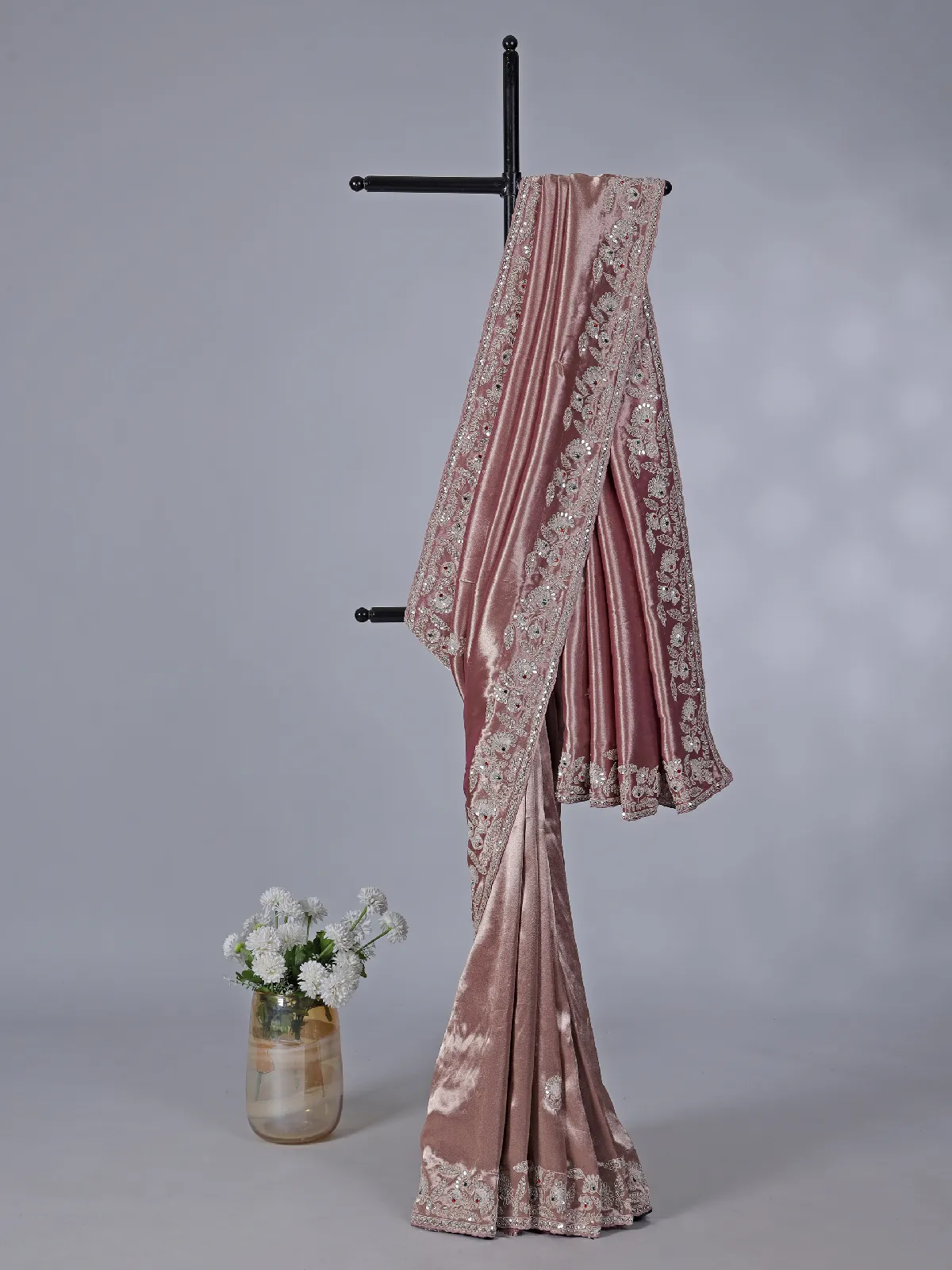 Pastel peach soft tissue silk saree with exquisite embellished work