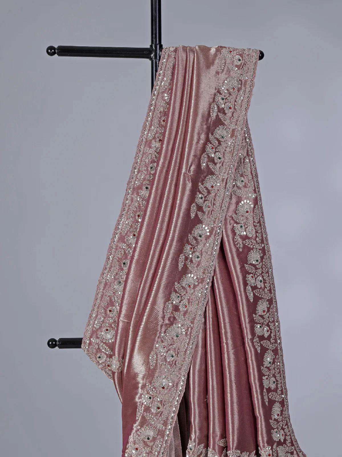 Pastel peach soft tissue silk saree with exquisite embellished work