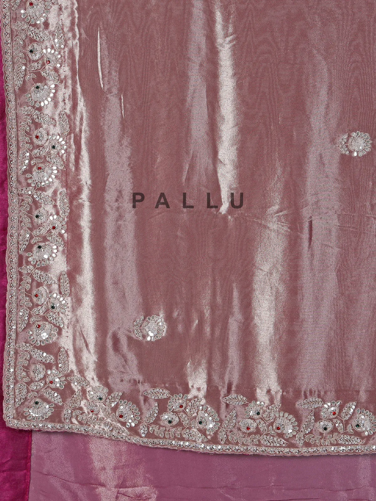 Pastel peach soft tissue silk saree with exquisite embellished work
