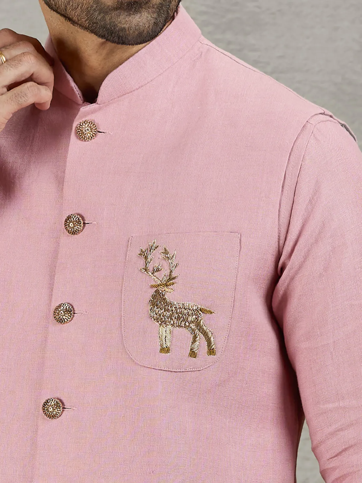 Pastel pink linen waistcoat with shirt and embellished crest detail