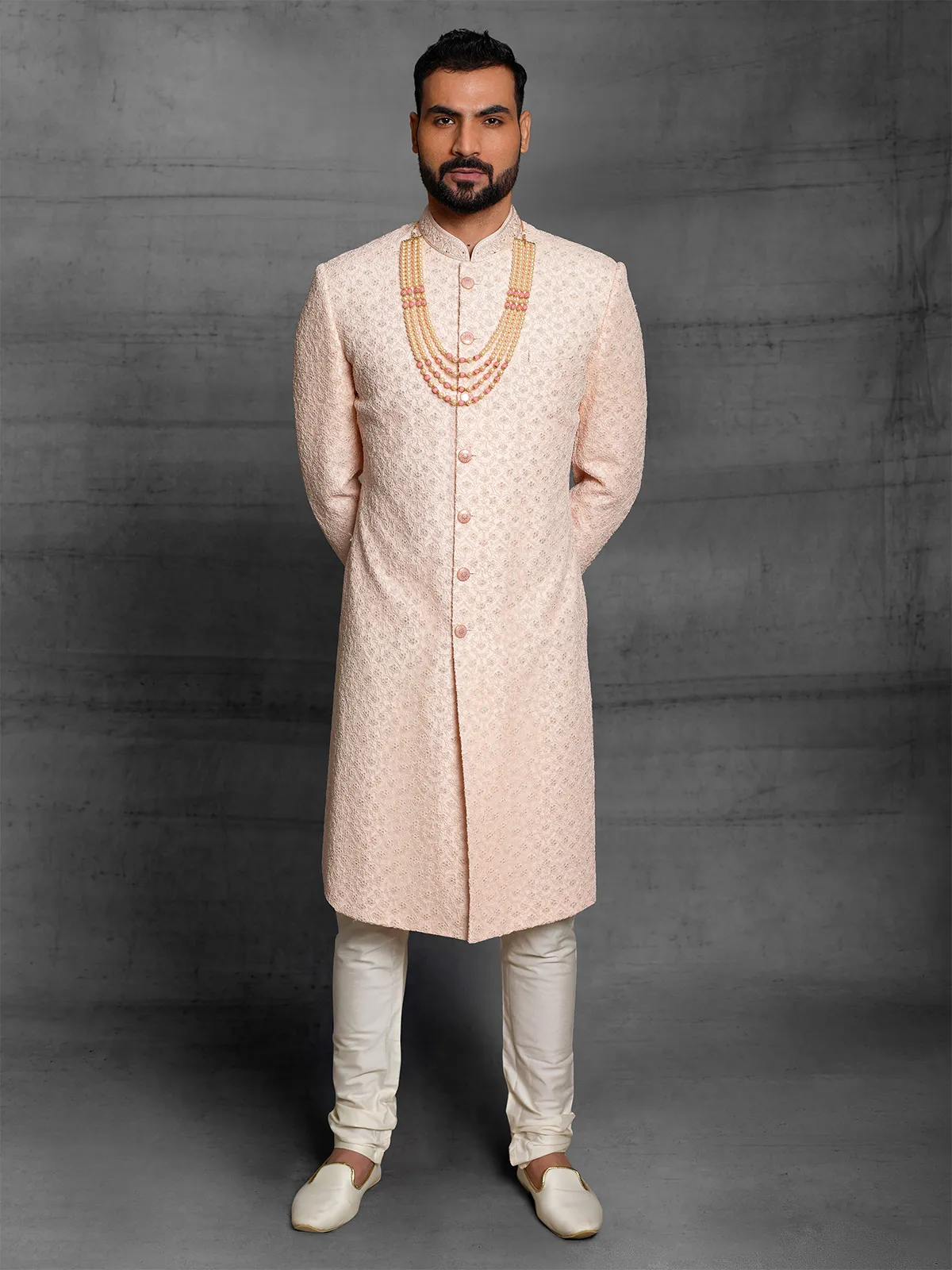 Peach color silk sherwani for wedding events