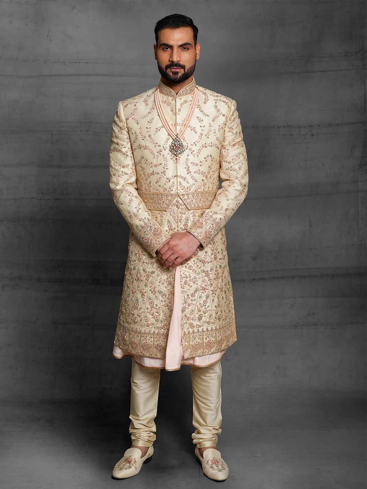 Peach hued silk wedding wear dual layer sherwani