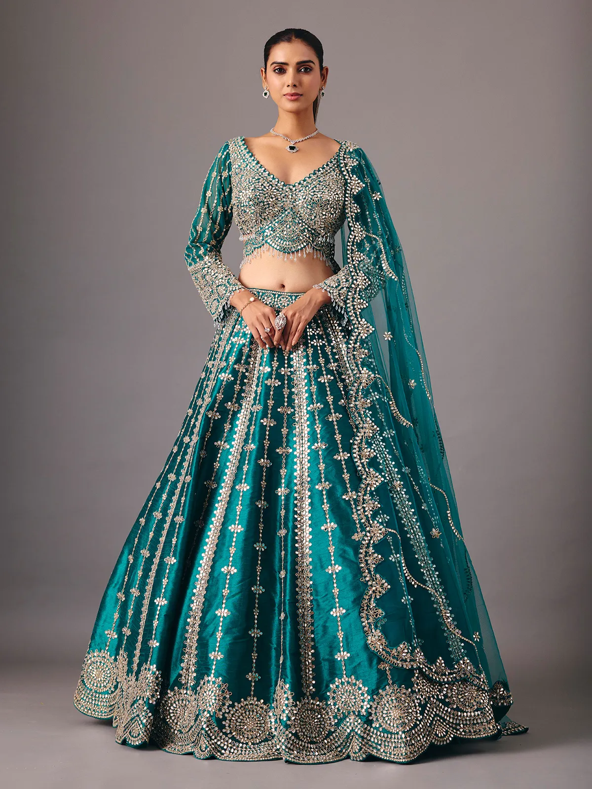 Peacock green raw silk lehenga choli with mirror accents
