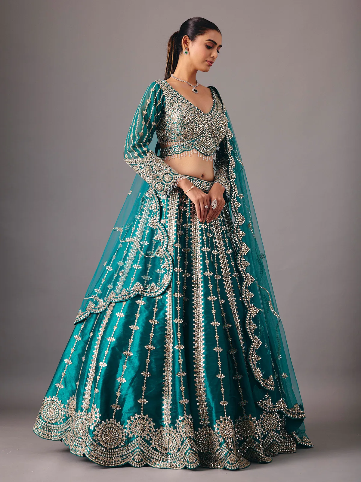 Peacock green raw silk lehenga choli with mirror accents