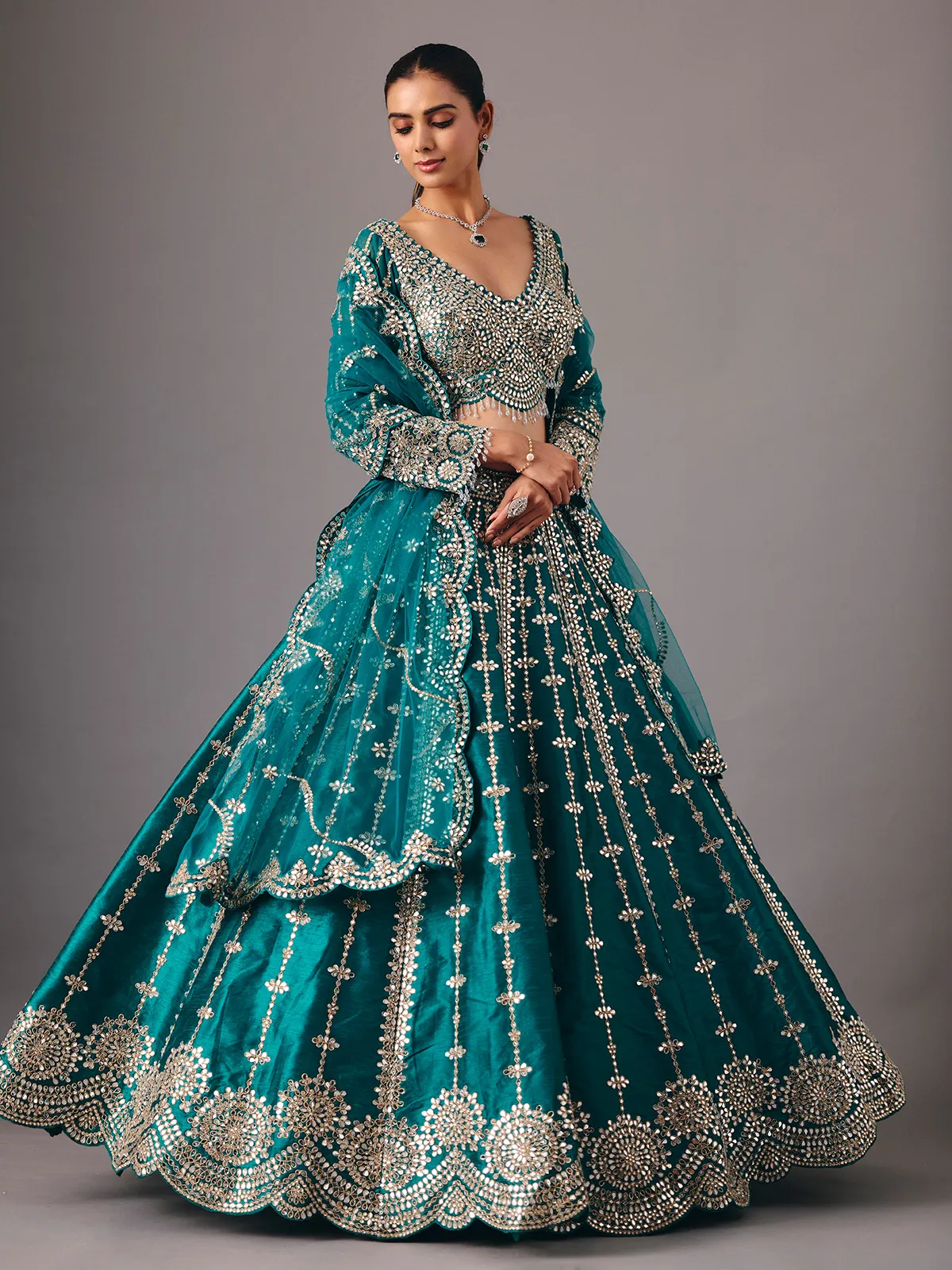 Peacock green raw silk lehenga choli with mirror accents