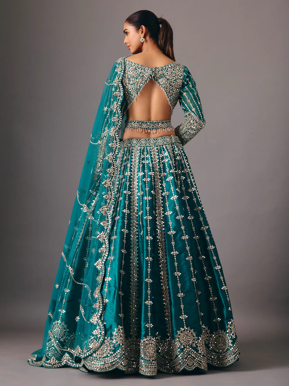 Peacock green raw silk lehenga choli with mirror accents