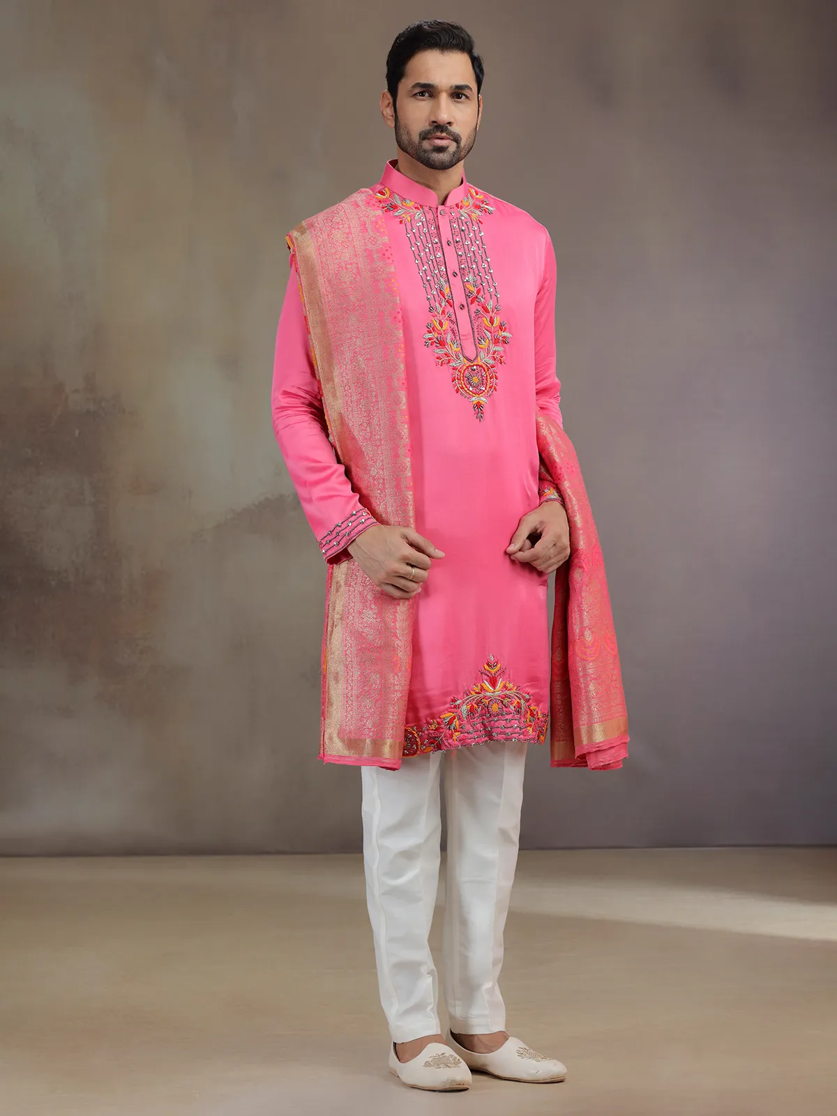 kurta pajama dress Unveil your charm with the embroidered and in comfort fabric, where the Mandarin Collar, Loop Buttons intertwine in a game of bold elegance. The matching Pajama adds a mischievous The kurta features exquisite embroidery meticulously handcrafted by skilled artisans adorning the neckline cuffs and hemline Pink Wedding Wear Kurta Pajama