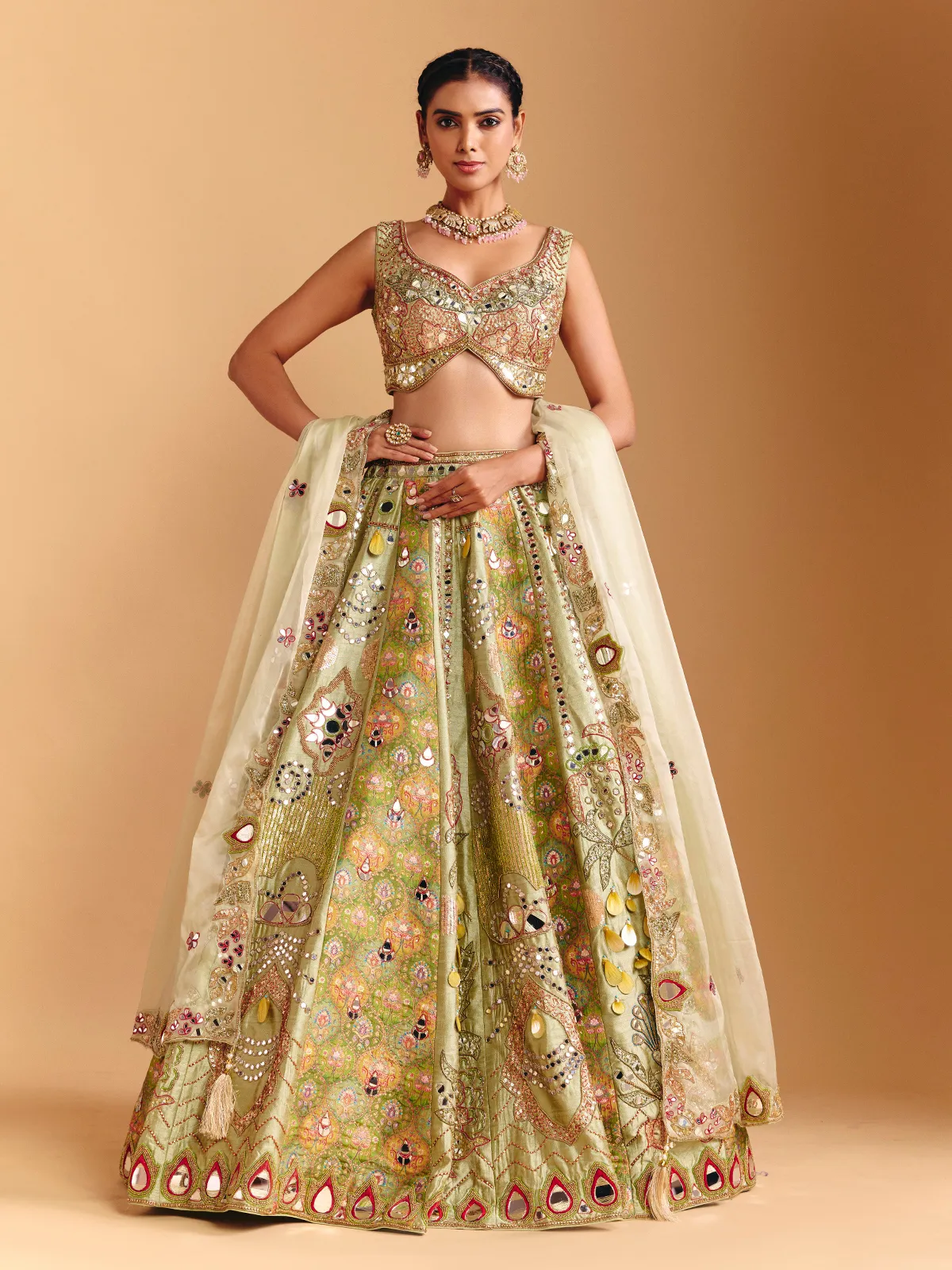 Pista green raw silk lehenga choli with printed artistry
