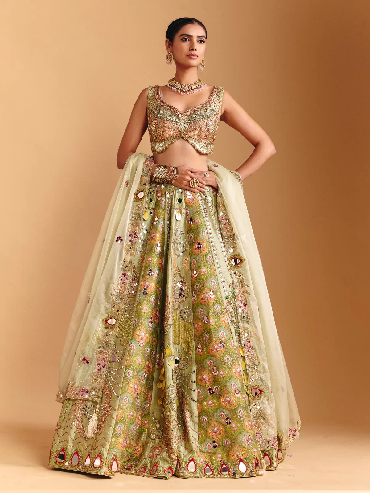 Pista green raw silk lehenga choli with printed artistry