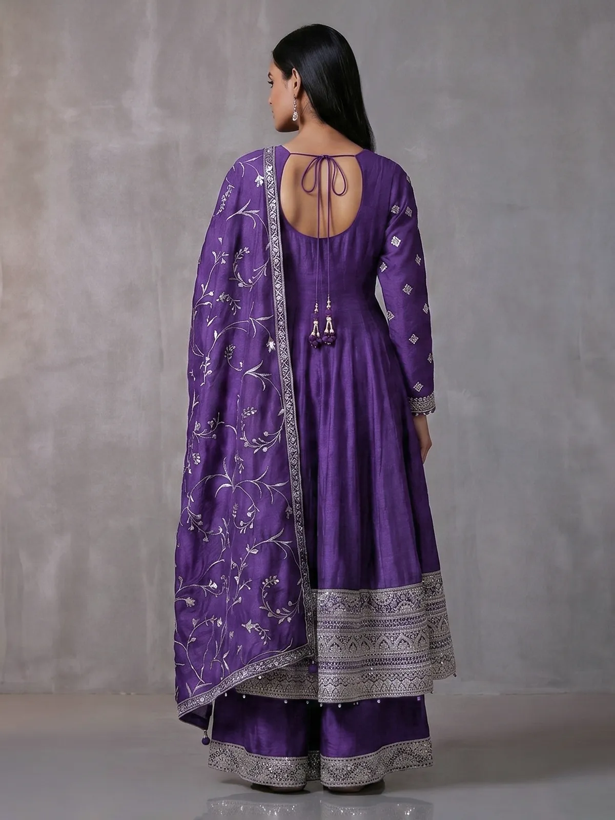 Purple silk anarkali suit with pearl embellishments