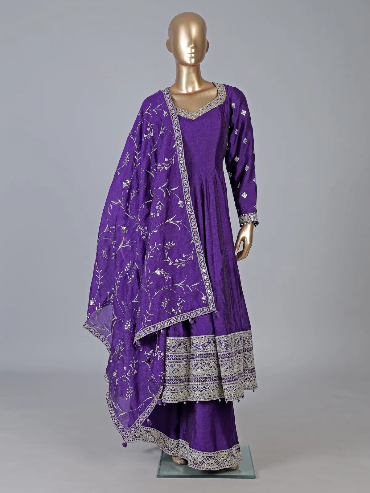 Purple silk anarkali suit with pearl embellishments