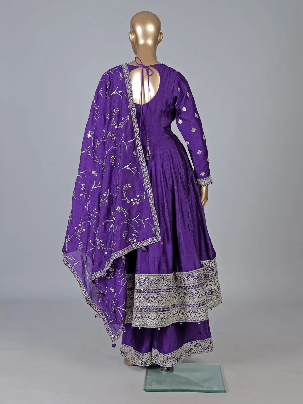 Purple silk anarkali suit with pearl embellishments
