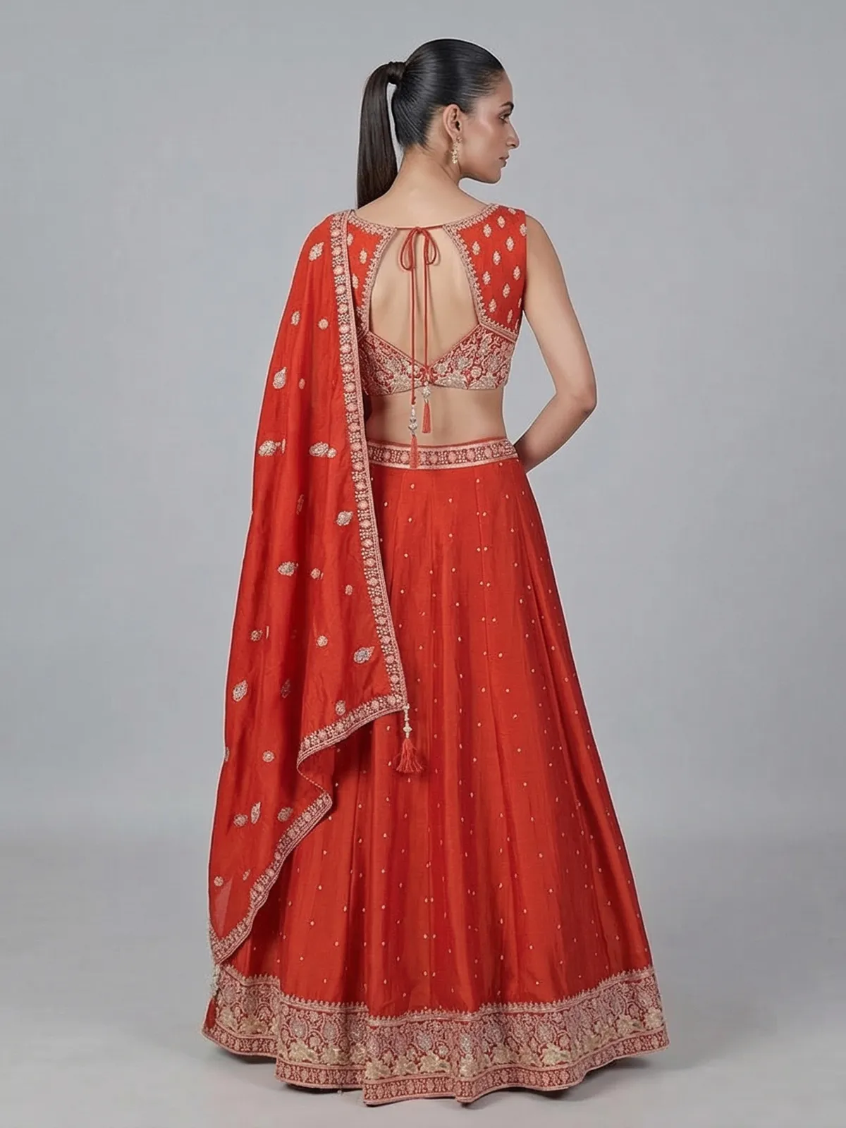 Radiant rust orange silk lehenga choli with embroidered sparkle