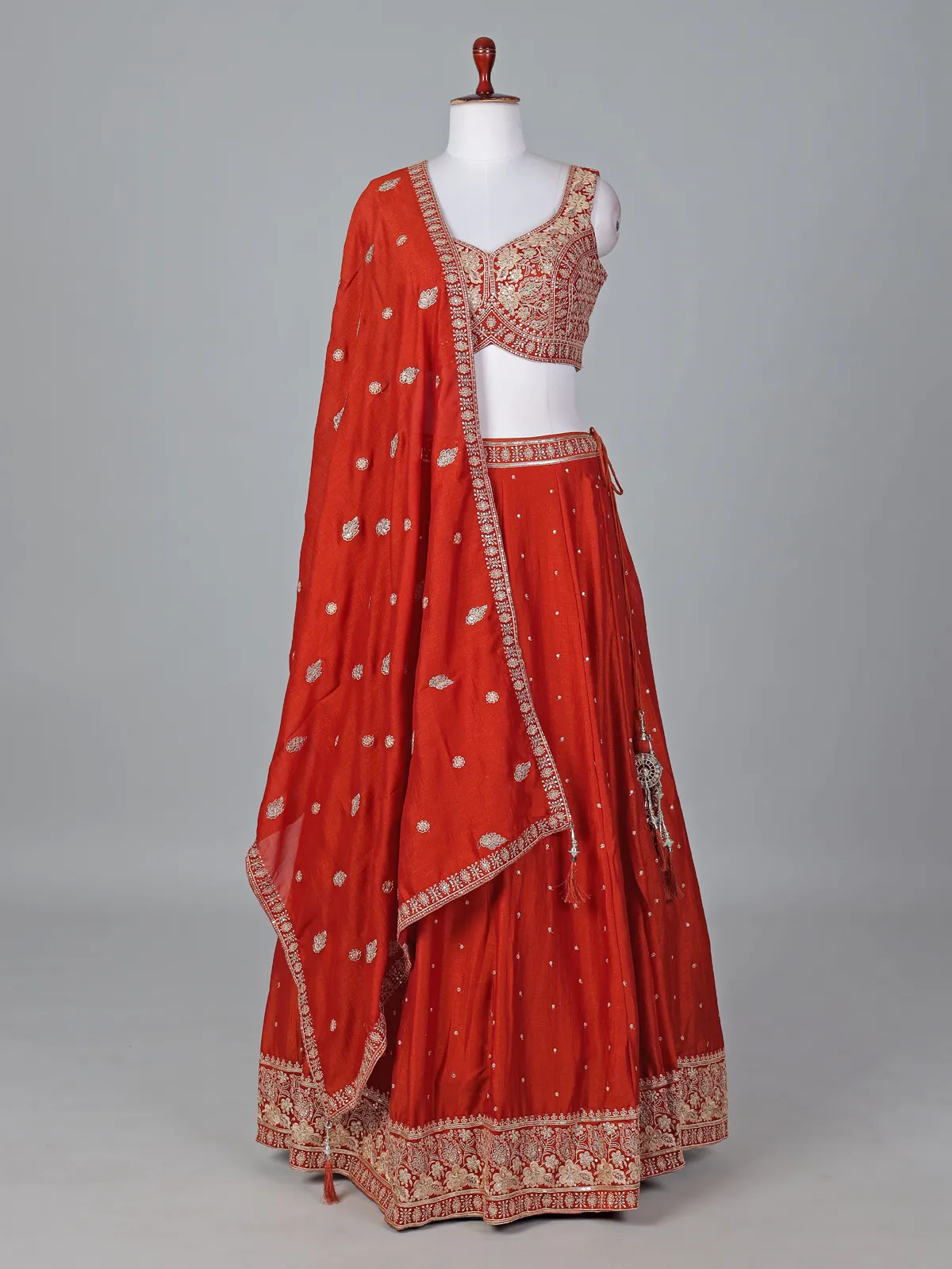 Radiant rust orange silk lehenga choli with embroidered sparkle