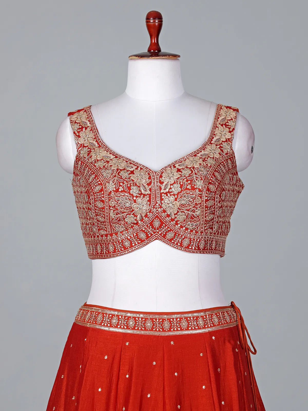Radiant rust orange silk lehenga choli with embroidered sparkle
