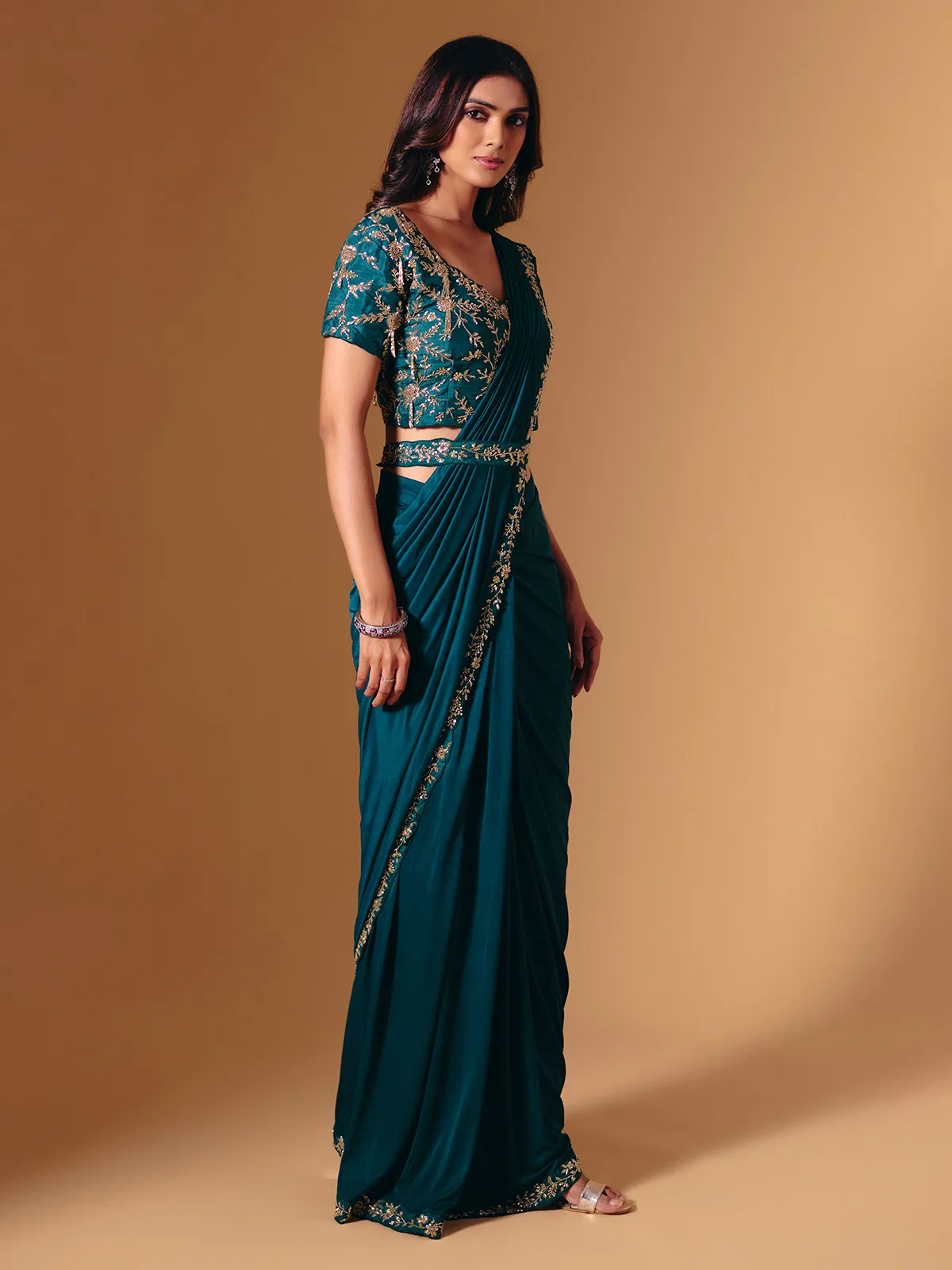 Rama green satin lycra saree with sparkling cutdana work