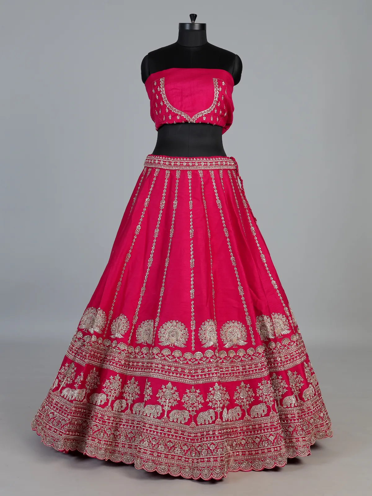 Rani pink bridal raw silk lehenga choli with embellished dupatta