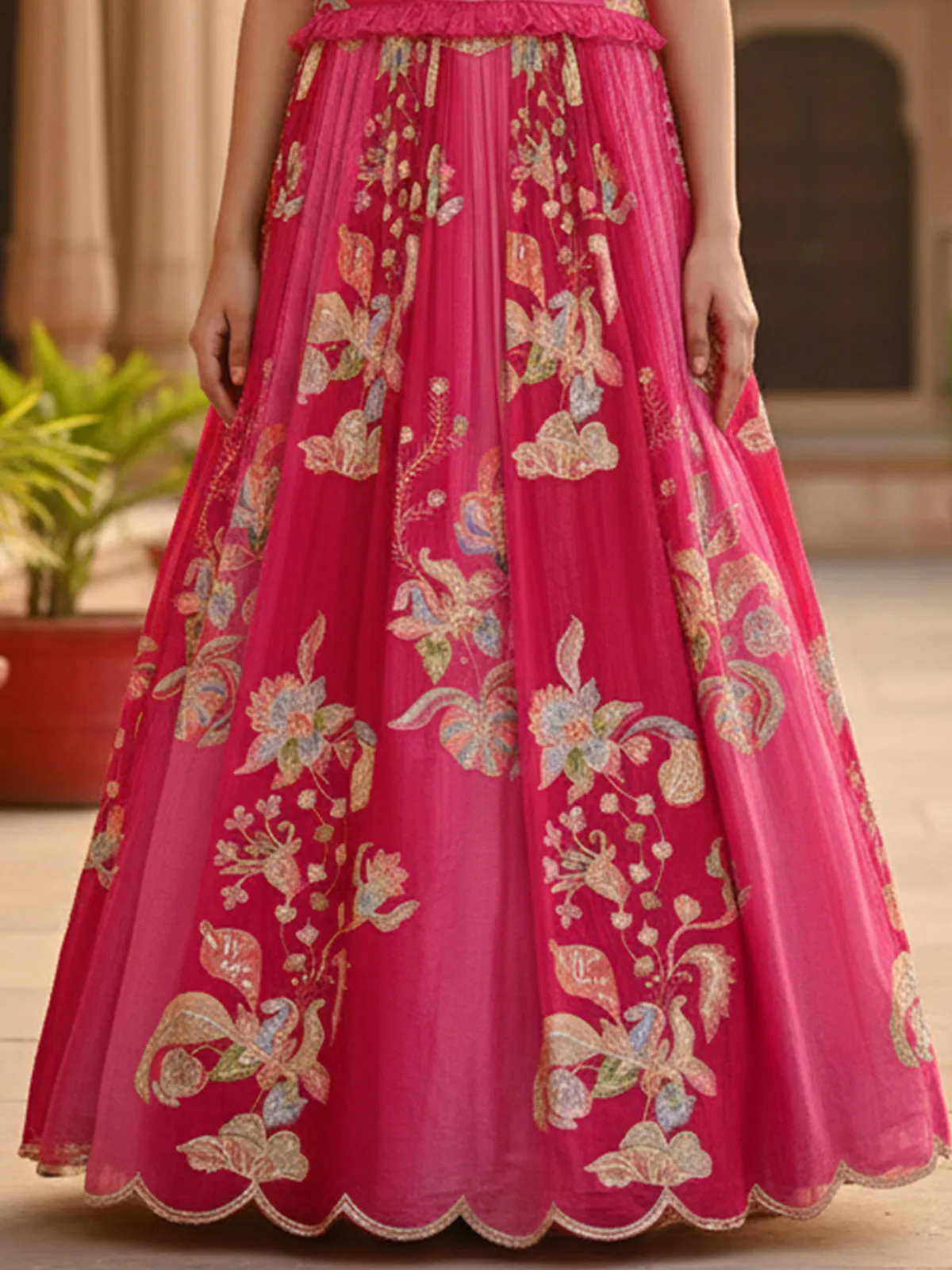 Rani pink chiffon lehenga choli with sleeveless choli