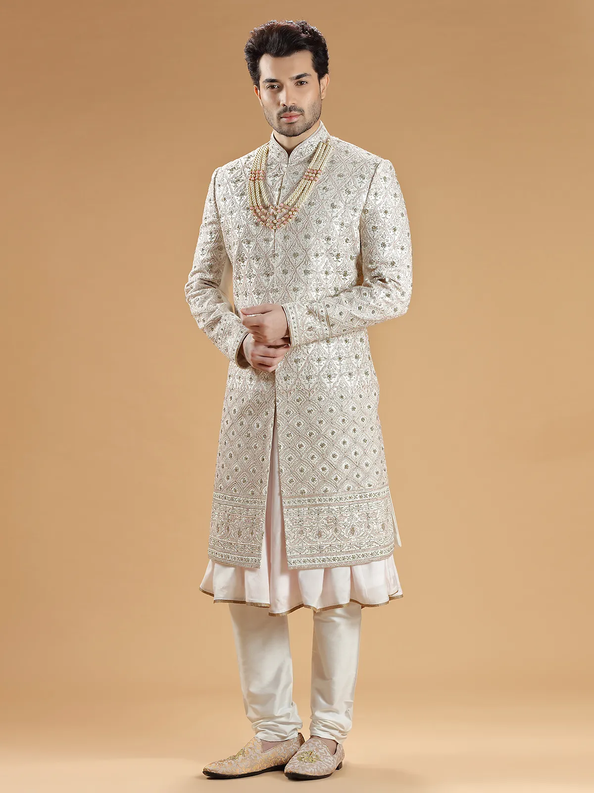 Rich raw silk cream hue groom sherwani