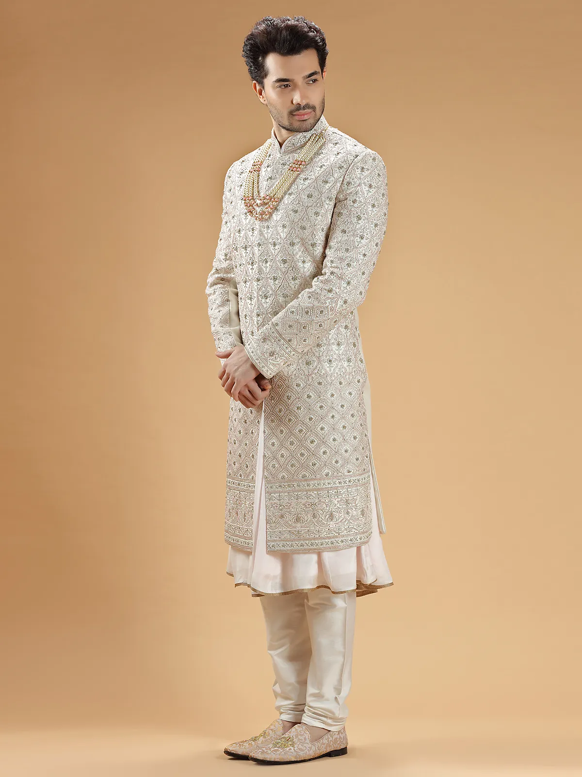 Rich raw silk cream hue groom sherwani