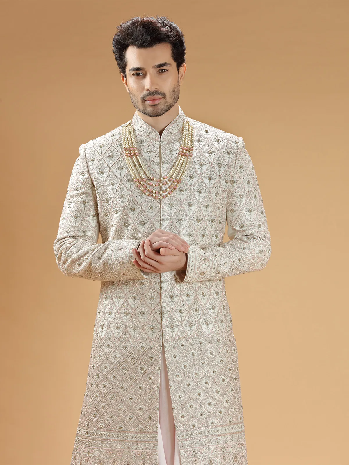 Rich raw silk cream hue groom sherwani