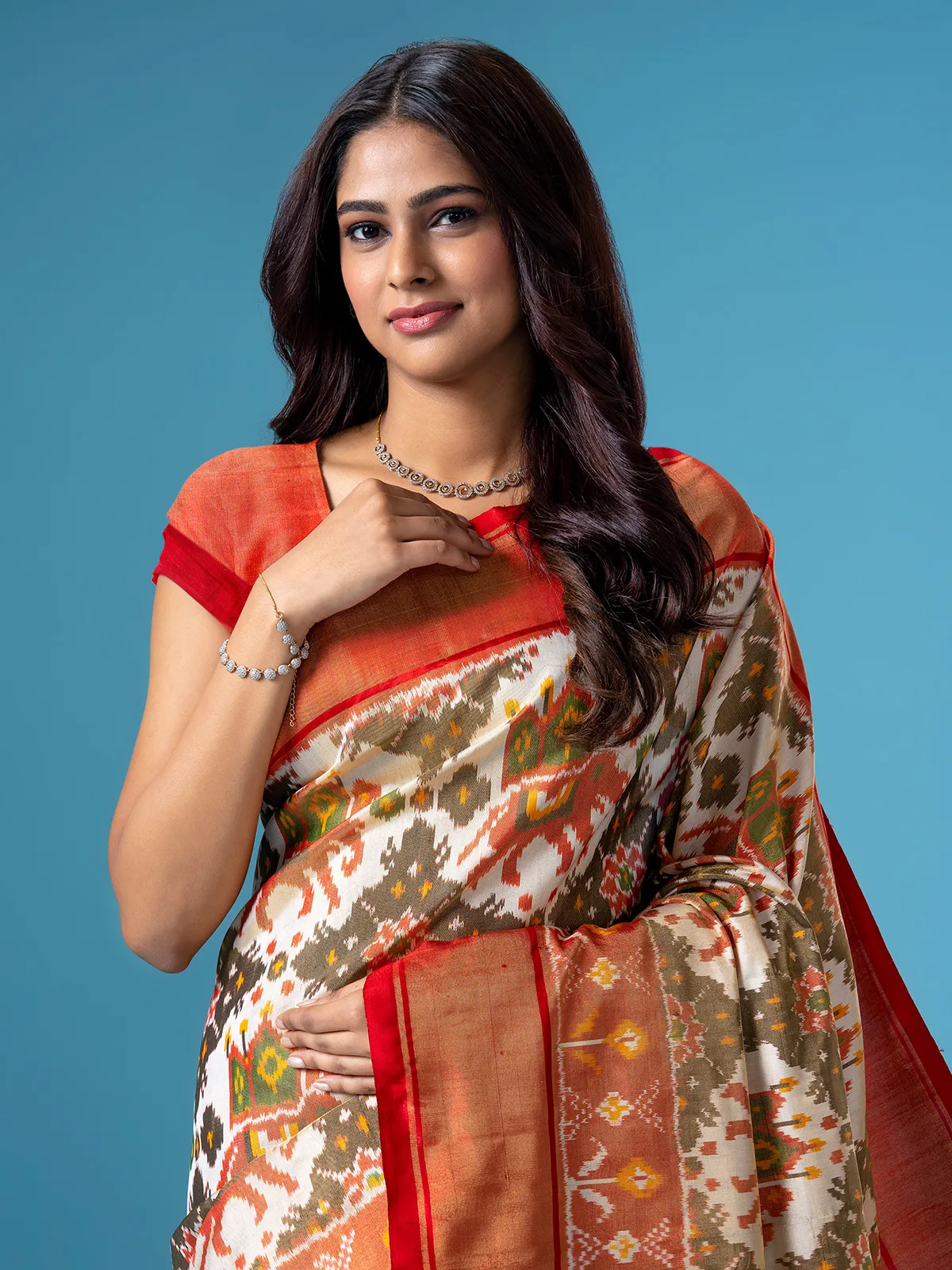 Stunning off white patola printed saree