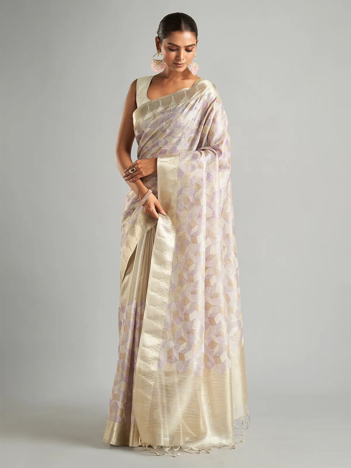 Stunning off-white tissue silk saree