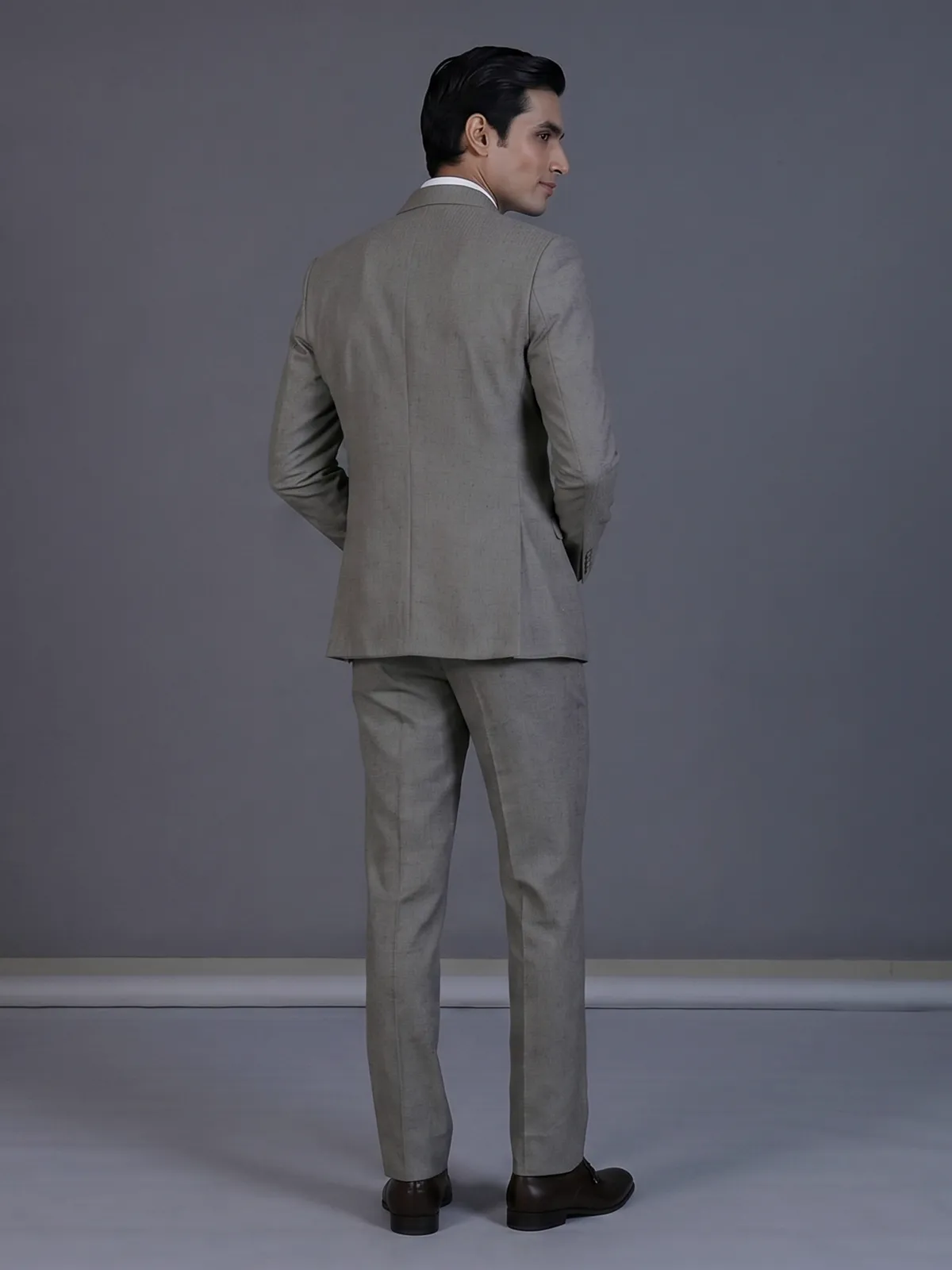 Taupe designer double breasted suit with textured birdseye peak lapel